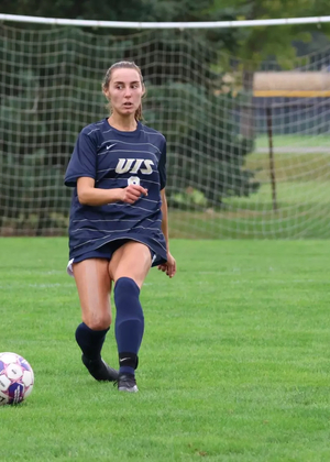 Megan Little playing the ball forward