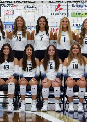 2026 UIS Volleyball team photo on court with coaches