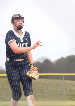 Calista Stahlhut pitching in blue UIS uniform