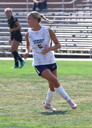 Mallory Herber playing soccer