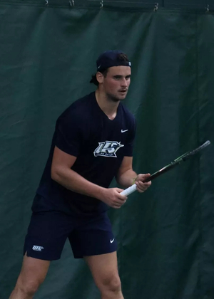 Antonio Ayerbe Streubel playing tennis in UIS uniform