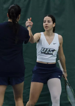 Carmen Llopis Fabra and Cristine Mendoza in doubles play