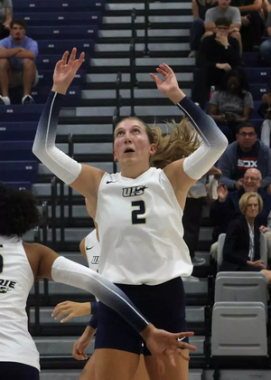 Madi Siefken setting for UIS volleyball