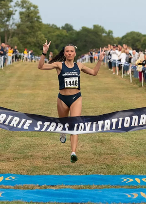 Madelyn Miller-Ross crosses finish line at cross country meet