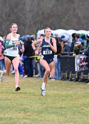 Madelyn Miller-Ross finishing a cross country race