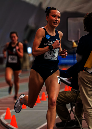 Madelyn Miller-Ross racing in blue UIS uniform at GLVC Indoor Championship