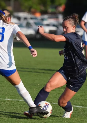 Abbie Gleason playing soccer