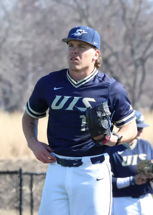 Adam Wibbenmeyer pitching for UIS baseball in blue jersey