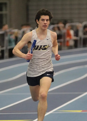 Carson Cowling crossing the finish line