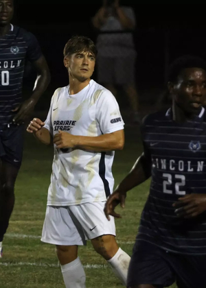 Carter Downen and Gentil Selemani on soccer field