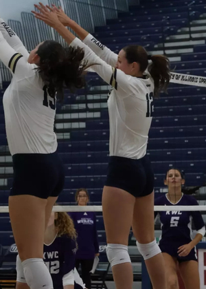 Makenna Cox and Lexie Vick block at the net