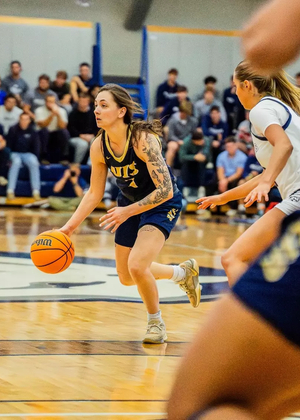 Kennedy Osterman playing basketball