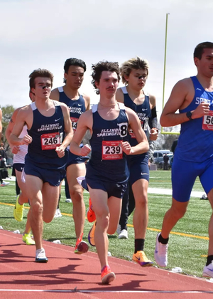 UIS Men's Track runners in blue uniforms running on track