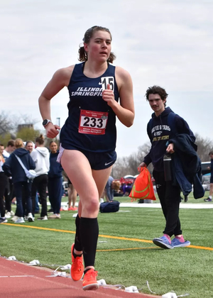 Allison Thompson running track in blue UIS uniform