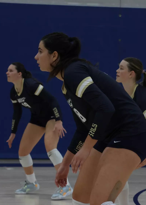Eirini Glynou, Anna Laincz, and Makenna Cox defensively