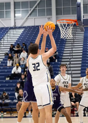 Alex Stell playing basketball at UIS