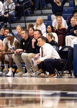 Men’s basketball bench and crowd