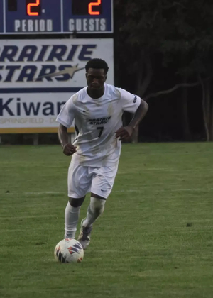 Gentil Selemani playing soccer