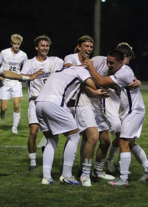 UIS men's soccer celebrates a goal