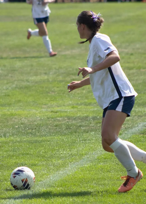 Abbie Gleason playing soccer