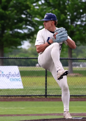 Jaden Mathon pitching for UIS in white uniform