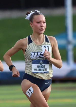 Maddie Miller-Ross running track in gold UIS uniform