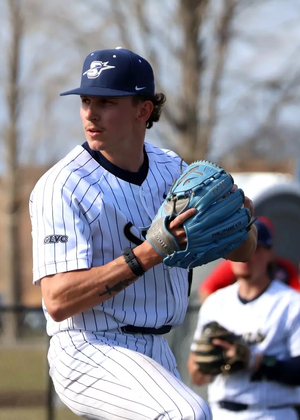 Jaden Mathon pitching in white UIS uniform