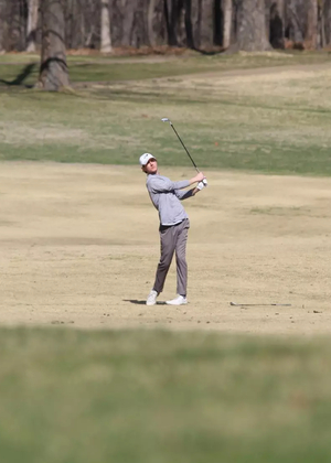 Brady Wilson golfing in fairway