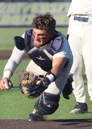 Ivan Dahlberg diving for the tag at home plate
