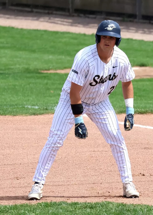 Corey Boyette base running in white UIS uniform
