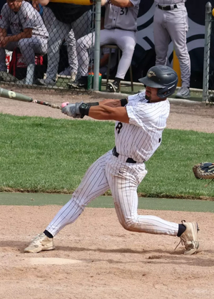 Noah Caceres batting in a UIS baseball game
