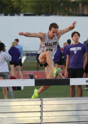 Ryan Jones jumping water barrier in steeplechase