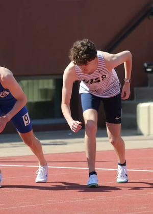 Lucas Naugle on starting line in outdoor track