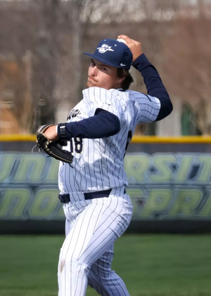 Isaac Graf pitching in white UIS baseball uniform
