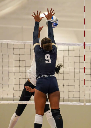 Erica Sledge blocking at the net