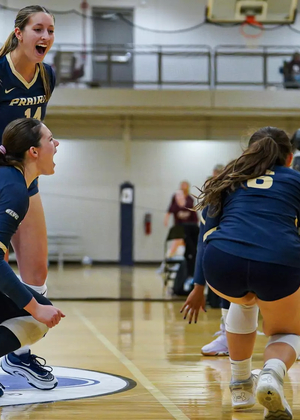 UIS volleyball team celebration