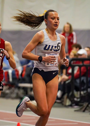 Maddie Miller racing indoor track