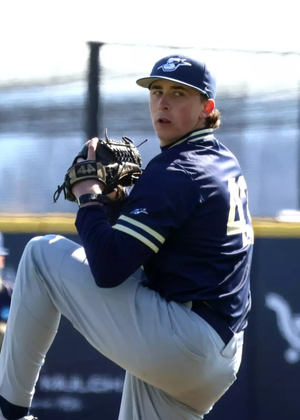 Jacob McPherson pitching in blue UIS baseball uniform