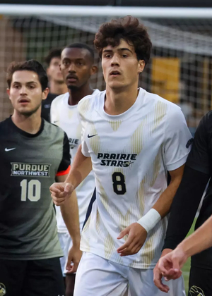 Jero Bencomo and PNW defenders in soccer game
