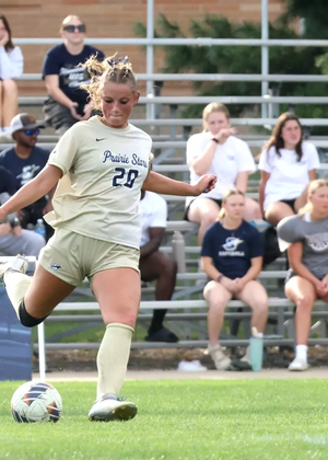 Jules Sather playing soccer in UIS gold