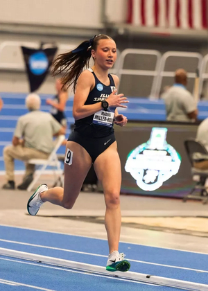Maddie Miller-Ross running in blue uniform at indoor track & field national championship
