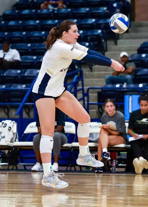 Makenna Cox passing a volleyball