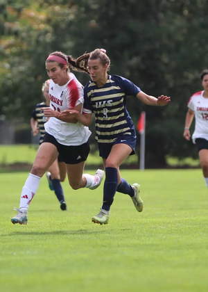 Megan Little playing soccer