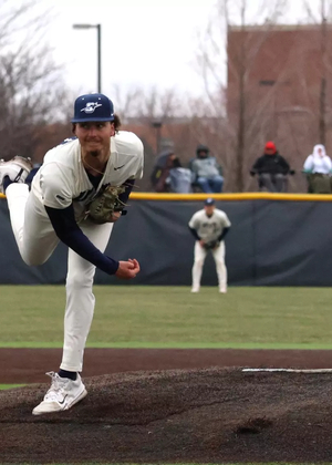 Richie Snider pitching in white UIS Baseball uniform