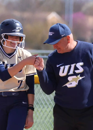 Rosie Bartletti and Coach Dan Frank on first base 