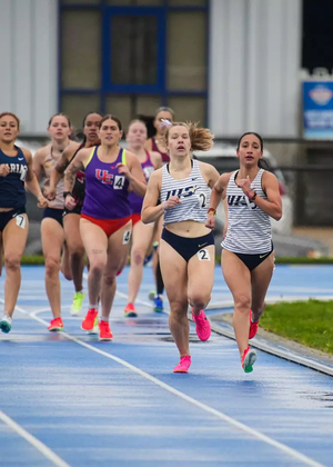 Lillian Buzani and Camille Terre running outdoor track