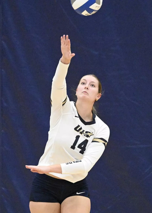 Kendall Johnson serving volleyball