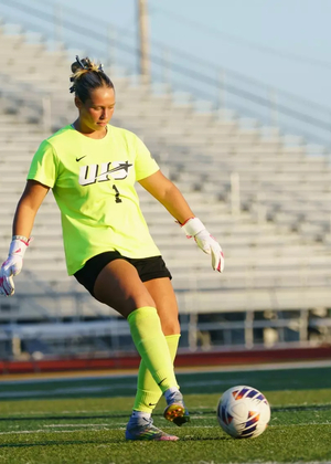 Gigi Yurevich, UIS women's soccer goalkeeper in yellow uniform