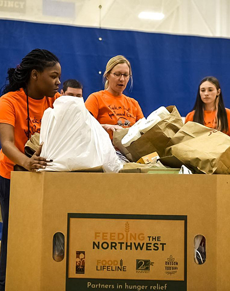 Students with a box of collected food