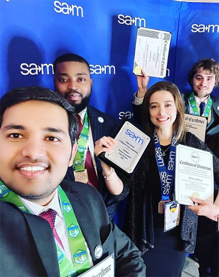 SAM students holding awards